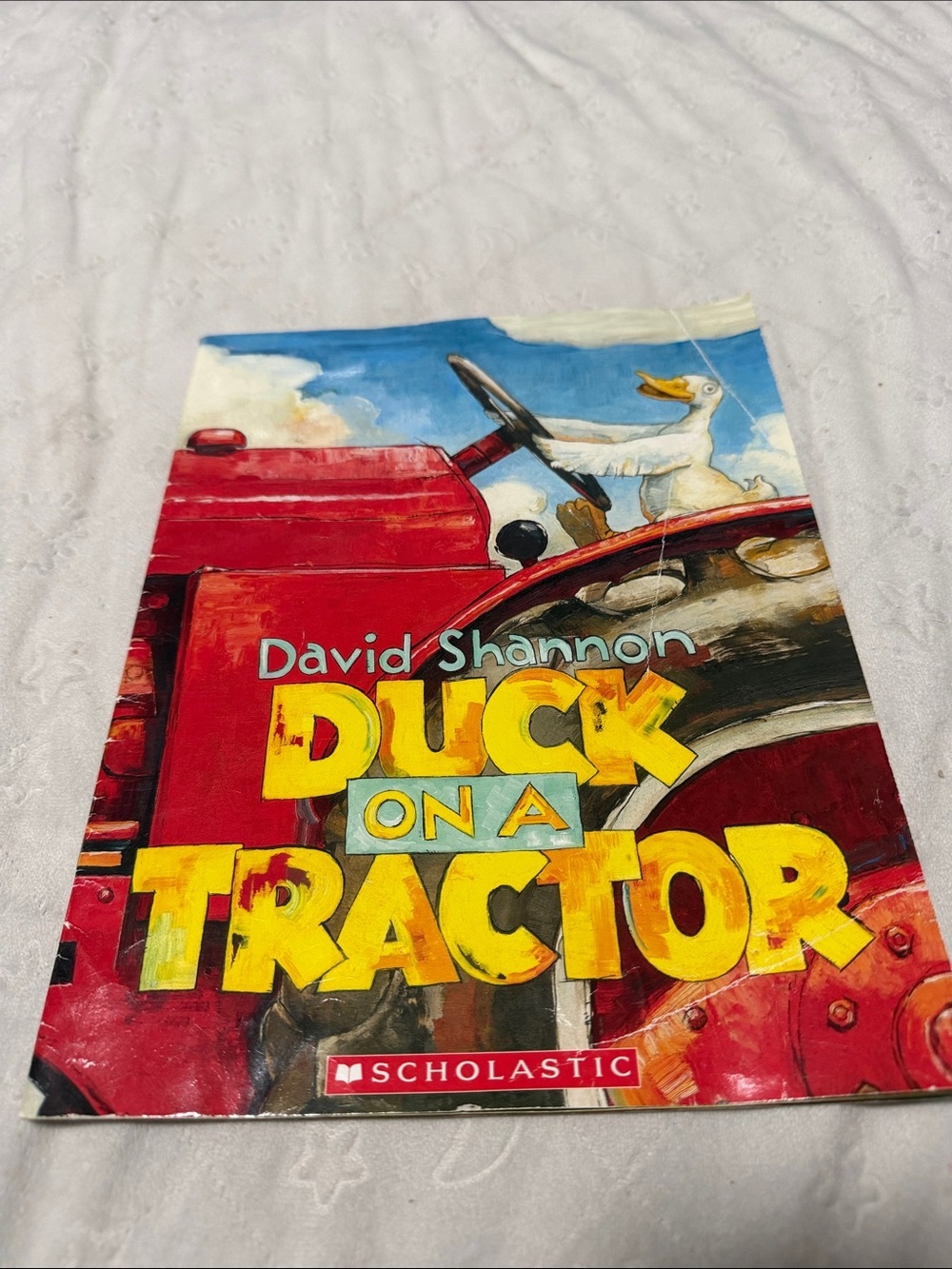 Scholastic Children's Book - Red Tractor with Yellow Title and White Duck